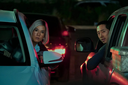 Ali-Wong-and-Steven-Yeun-lean-out-their-car-windows-in-BEEF.png